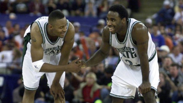 Michigan State Spartans guard Mateen Cleaves celebrates with a teammate.